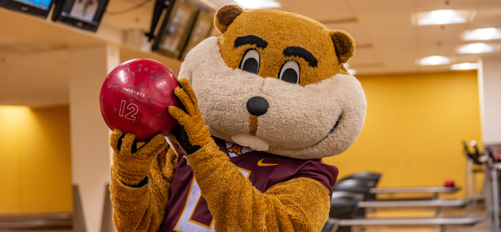 Goldy Gopher with a bowling ball at Goldy's Gameroom.